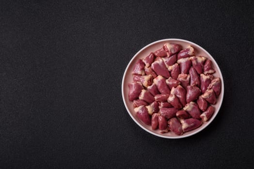 Chicken raw heart, red duck or turkey internal organs as an ingredient for dinner preparation