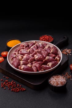 Chicken raw heart, red duck or turkey internal organs as an ingredient for dinner preparation