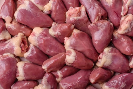 Chicken raw heart, red duck or turkey internal organs as an ingredient for dinner preparation