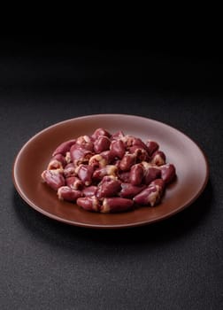 Chicken raw heart, red duck or turkey internal organs as an ingredient for dinner preparation