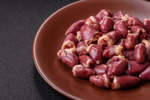Chicken raw heart, red duck or turkey internal organs as an ingredient for dinner preparation