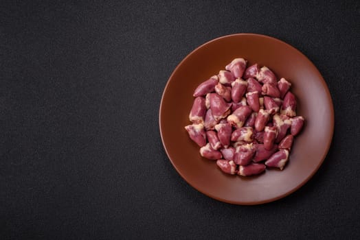 Chicken raw heart, red duck or turkey internal organs as an ingredient for dinner preparation