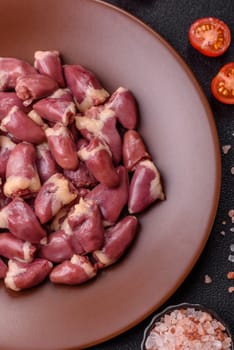 Chicken raw heart, red duck or turkey internal organs as an ingredient for dinner preparation