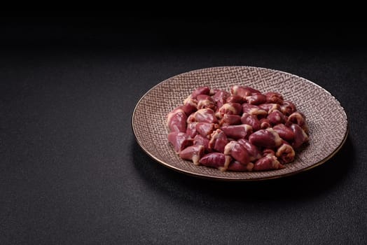 Chicken raw heart, red duck or turkey internal organs as an ingredient for dinner preparation