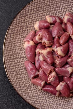 Chicken raw heart, red duck or turkey internal organs as an ingredient for dinner preparation