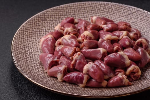 Chicken raw heart, red duck or turkey internal organs as an ingredient for dinner preparation