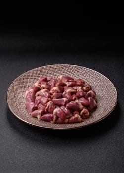 Chicken raw heart, red duck or turkey internal organs as an ingredient for dinner preparation