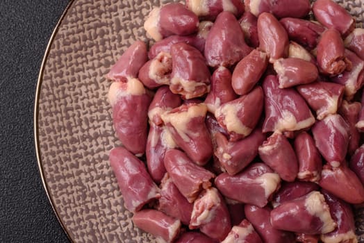 Chicken raw heart, red duck or turkey internal organs as an ingredient for dinner preparation