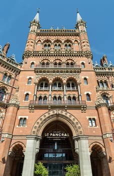 London, UK - Apr 11, 2025 - A view and outside entrance of the gothic building where the St. Pancras Renaissance Hotel is based in Kings Cross. Facade of Victorian architecture at the Midland Grand Hotel, use it as your Wallpaper, Poster and Space for text, Selective focus.