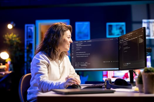 Joyous developer showing happiness after securing company servers from virus attacks. Smiling IT remote employee feeling positive emotions after succeeding building firewalls protecting data