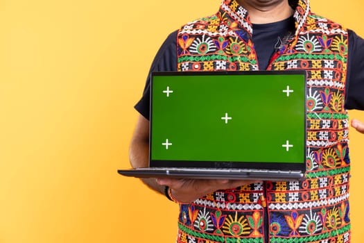 Man holding green screen laptop, using it for solving projects in office for company, studio background. Close up shot of employee using mockup notebook device at work to solve job tasks