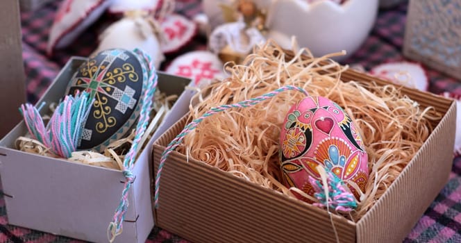 Colorful pysanka eggs arranged in decorative boxes create a charming display for Easter celebrations.