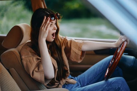 A surprised young woman in a casual outfit and sunglasses reacts in shock while driving, showcasing emotions in a car setting with a bright green background.