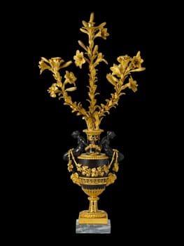 This exquisite antique three-light candelabrum, crafted in France around 1785, features intricate gold and black detailing with floral accents. Its opulent baroque design adds timeless luxury to vintage decor collections. Perfect for upscale interiors, this ornate piece evokes historical grandeur and masterful craftsmanship.