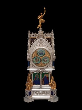 This magnificent antique table clock with calendar, crafted by Lucien Falize in 1881, features intricate silver and gold detailing in a striking gothic design. Its opulent craftsmanship adds timeless luxury to vintage decor collections.