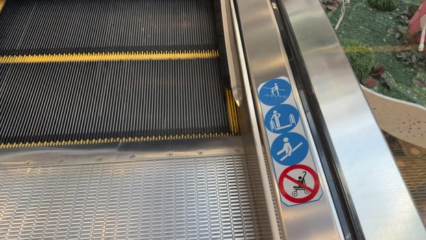 Sticker with signs with rules for using escalator. Safe behavior on escalator to prevent injuries when going up and down. Infographics with safety precautions on public escalator