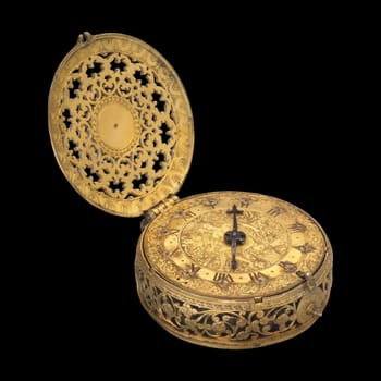 this stunning image showcases an ornate gold antique clock watch, a british piece originating from london around 1600-1610. the intricate engravings and detailed craftsmanship highlight the luxury and historical significance of this early timekeeping device.
