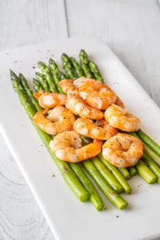 Golden shrimp add crunch and color to soft green spears of asparagus