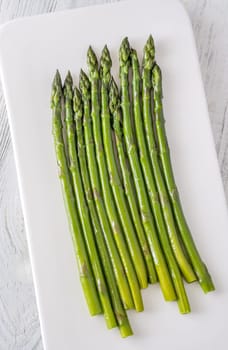 Slender stalks shine with moisture, each bright green spear cooked to perfect tenderness