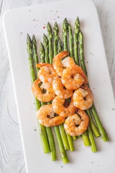 Golden shrimp add crunch and color to soft green spears of asparagus