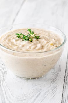 Herbed sauce glows softly as thyme floats atop rich, tangy blue cheese