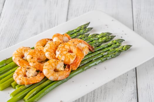 Golden shrimp add crunch and color to soft green spears of asparagus