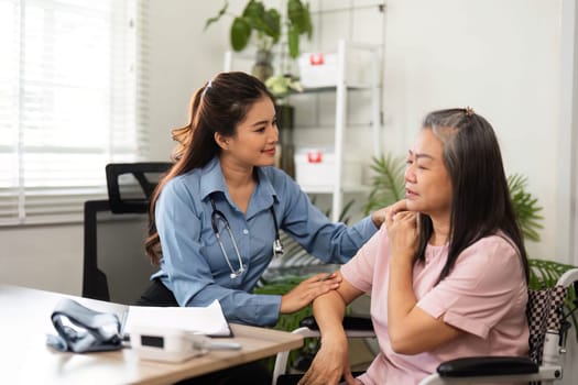 A caring nurse focuses on her elderly patient during a home checkup, highlighting the importance of patient comfort and emotional support in healthcare.