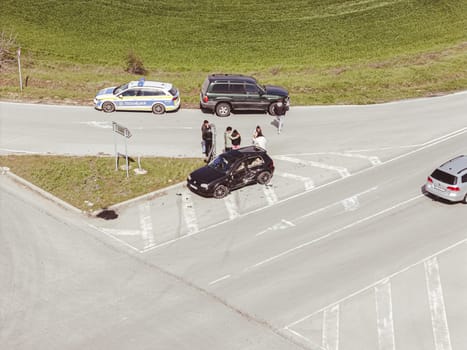 Top down view intersection with Car crash accident. Traffic police draw up a traffic accident report.