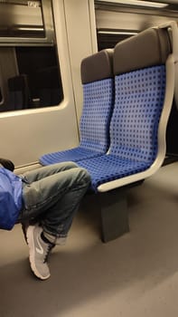October 17 2024 Bad Schandau Germany Europe Train seat feet men people indoor furniture travel tourism transport shotlisttravel . High quality photo editorial