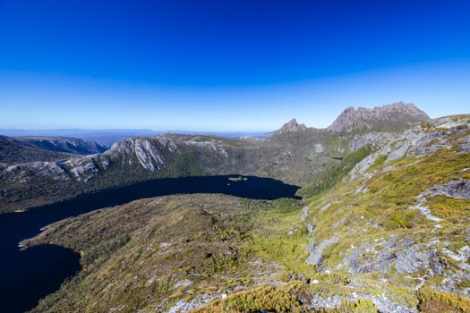 The view of mountain landscape from Marions Lookout over Dove Lake towards Hansons Peak and Cradle Mountain on a warm autumn morning in Cradle Mountain, Tasmania, Australia