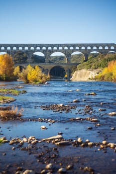 Vers-Pont-du-Gard, France - November 21, 2023:  Vertical photograph of the Pont du Gard over the Gardon River, in Provence, southern France. - Photo by WillyMobilo