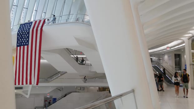 New York City, United States - 10 Sept 2023: World Trade Center Oculus transport hub architecture. Manhattan Downtown Financial District, USA urban life. People. September 11 remembrance american flag