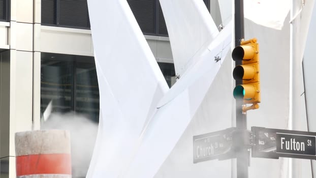 New York City, United States - 31 Aug 2023: Steam vapor vented, Church, Fulton street, orange tube stack. Hot smoke pipe. Con Edison Steam Operations system, Manhattan downtown financial district.