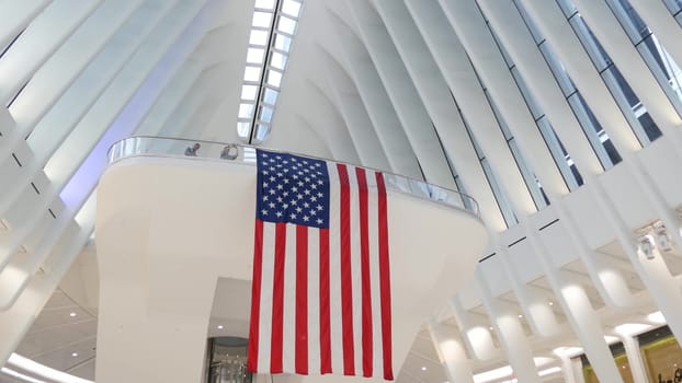 New York City, United States - 10 Sept 2023: World Trade Center Oculus architecture. Manhattan Downtown Financial District, USA. September 11 remembrance, large memorial american flag. 911 Patriot day