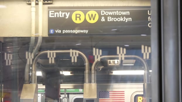 New York City, United States - 31 Aug 2023: Subway station interior. Text sign Downtown, Brooklyn. Manhattan underground metropolitan. Metro transport navigation. Public passenger railway. Oculus, WTC