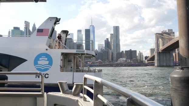 New York City, United States - 12 Sept 2023: Manhattan downtown skyline, ferry boat. Brooklyn bridge. World Trade Center skyscraper, ferryboat. East river waterfront panorama, buildings architecture.