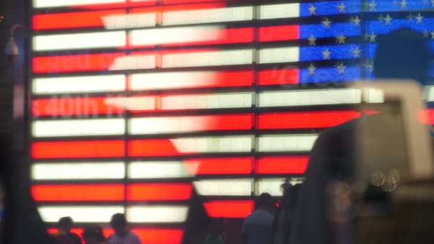 New York City, United States - 5 Sept 2023: Times Square, Manhattan Midtown Broadway street, USA. American flag, NYC urban life. Military island, army recruiting. People pedestrians silhouettes, crowd