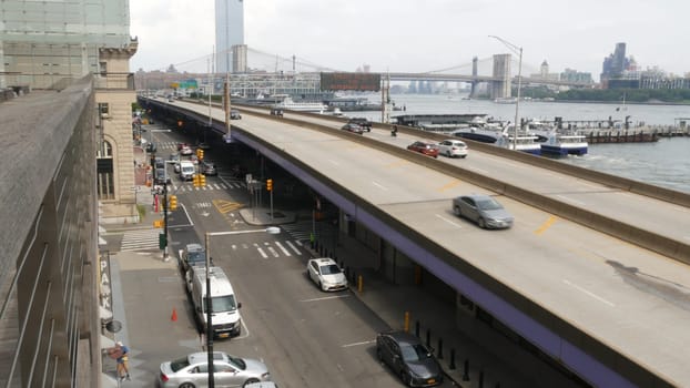 New York City, United States - 30 Aug 2023: Waterfront road, Manhattan Downtown financial district riverfront from Elevated Acre. Highway along East river, cars on waterside FDR drive. Brooklyn Bridge