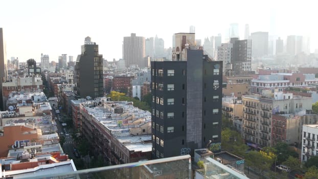 New York City, United States - 7 Sept 2023: Manhattan skyline cityscape. Rooftop graffiti on residential district buildings roofs. NYC Real Estate, urban streets architecture. Lower East Side district