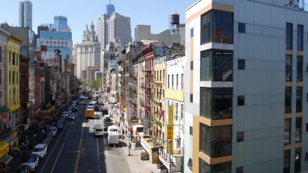 New York City, United States - 14 Sept 2023: Manhattan Chinatown East Broadway street, chinese ethnic district architecture, little Fuzhou, USA. World trade Center tower in Downtown. Manhattan Bridge.