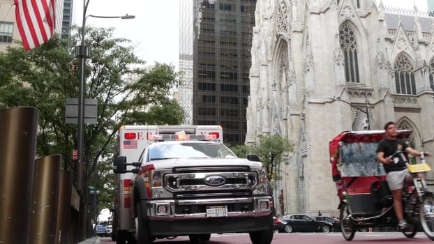 New York City, United States - 13 Sept 2023: NYFD Ambulance medical emergency, american fire department paramedic truck siren, Manhattan 5 fifth avenue. USA 911 vehicle on street. NYC first responders
