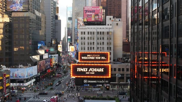 New York City, United States - 14 Sept 2023: Times Square, Manhattan Midtown Broadway street, USA. American NYC urban road traffic, people from above. Commercial illuminated billboard screens glowing.