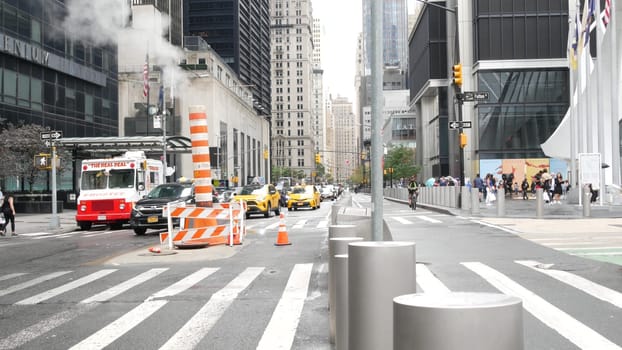 New York City, United States - 10 Sept 2023: Manhattan Downtown Church and Fulton street traffic, crossroad intersection zebra. Yellow taxi car. People near USA World Trade Center Oculus. Smoke stack.