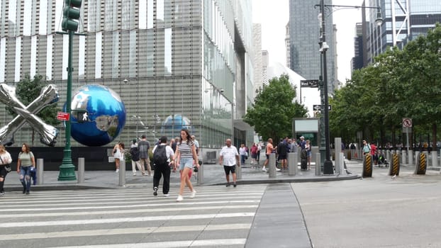 New York City, United States - 10 Sept 2023: Manhattan Downtown Financial District street crossroad intersection. Urban road car traffic. People pedestrian on zebra. World Trade Center memorial area.