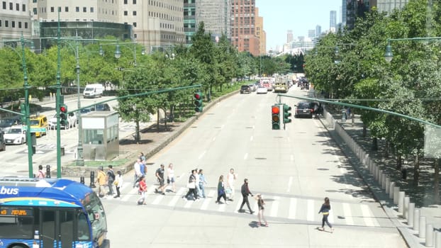New York City, United States - 31 Aug 2023: Manhattan Downtown Financial District street crossroad intersection. Urban road car traffic. People pedestrian on zebra. World Trade Center memorial area.