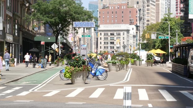 New York City, United States - 6 Sept 2023: Manhattan Midtown Broadway, 23 street, 5 avenue crossroad intersection. Worth Square near Madison Park, Flatiron, USA. Porcelanosa. People on chairs, tables