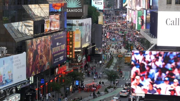 New York City, United States - 14 Sept 2023: Times Square, Manhattan Midtown Broadway street, USA. American NYC urban road traffic, people from above. Commercial illuminated billboard screens glowing.
