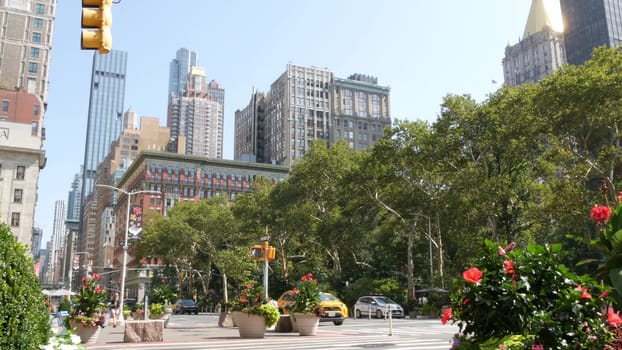 New York City, United States - 6 Sept 2023: Manhattan Midtown Broadway, 23 street, 5 avenue crossroad intersection. Worth Square near Madison Park and Flatiron Building, USA. People. Yellow taxi car