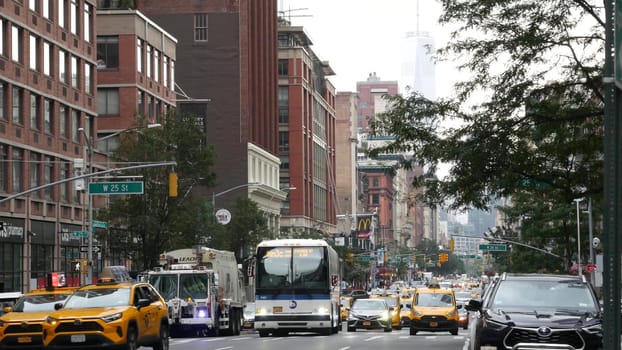 New York City, United States - 29 Aug 2023: Manhattan Chelsea street, Sixth 6 Americas avenue crossroad. Urban road, rush hour car traffic in USA. People, yellow taxi. World trade center. McDonalds.