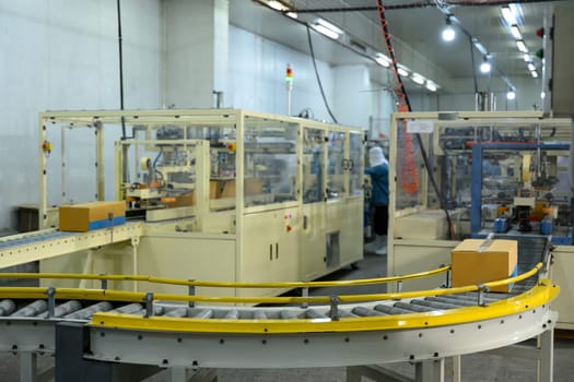Industrial packing machinery in a food manufacturing factory.